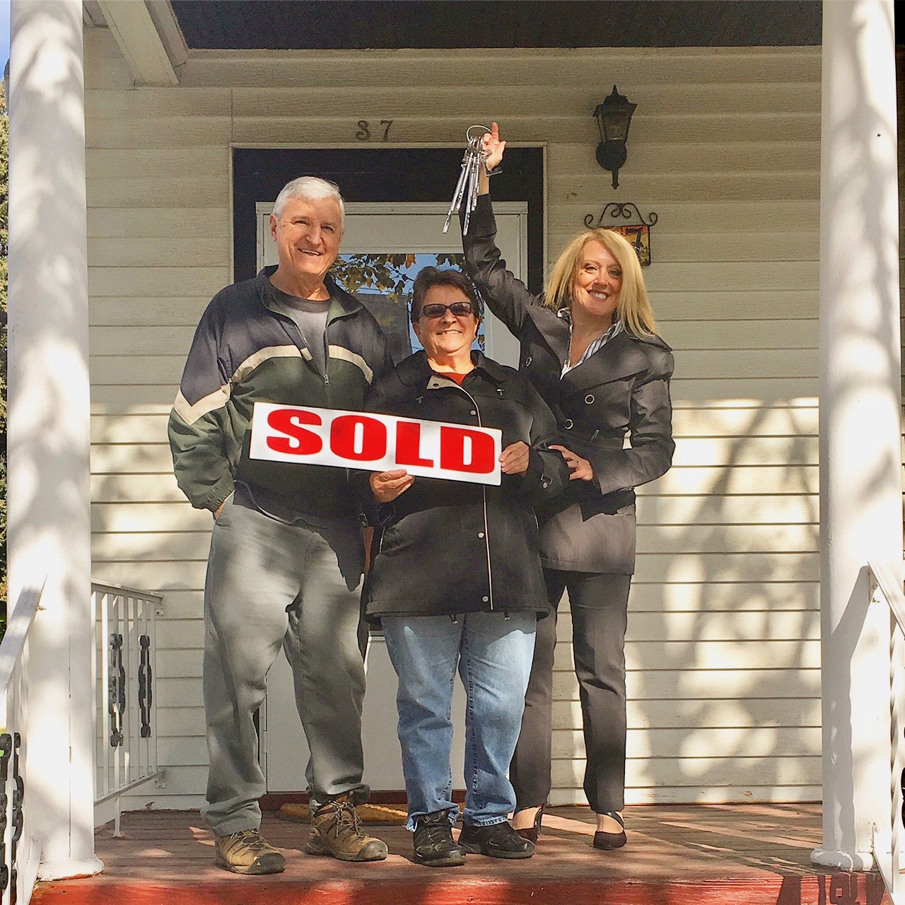 Holly Olivieri with new homeowners Anabel & Hector