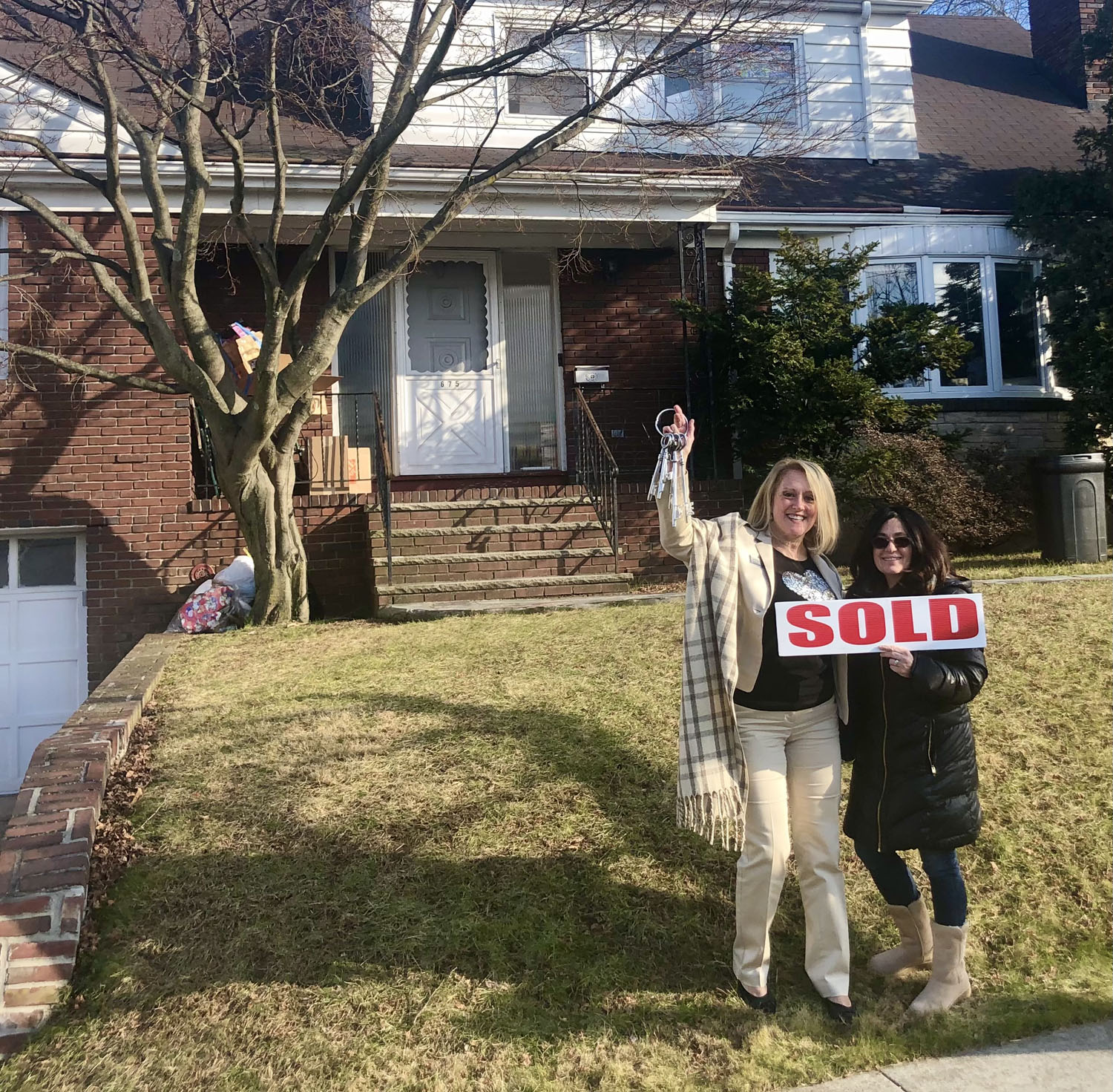 Holly Wiesner Olivieri with a happy new homeowner