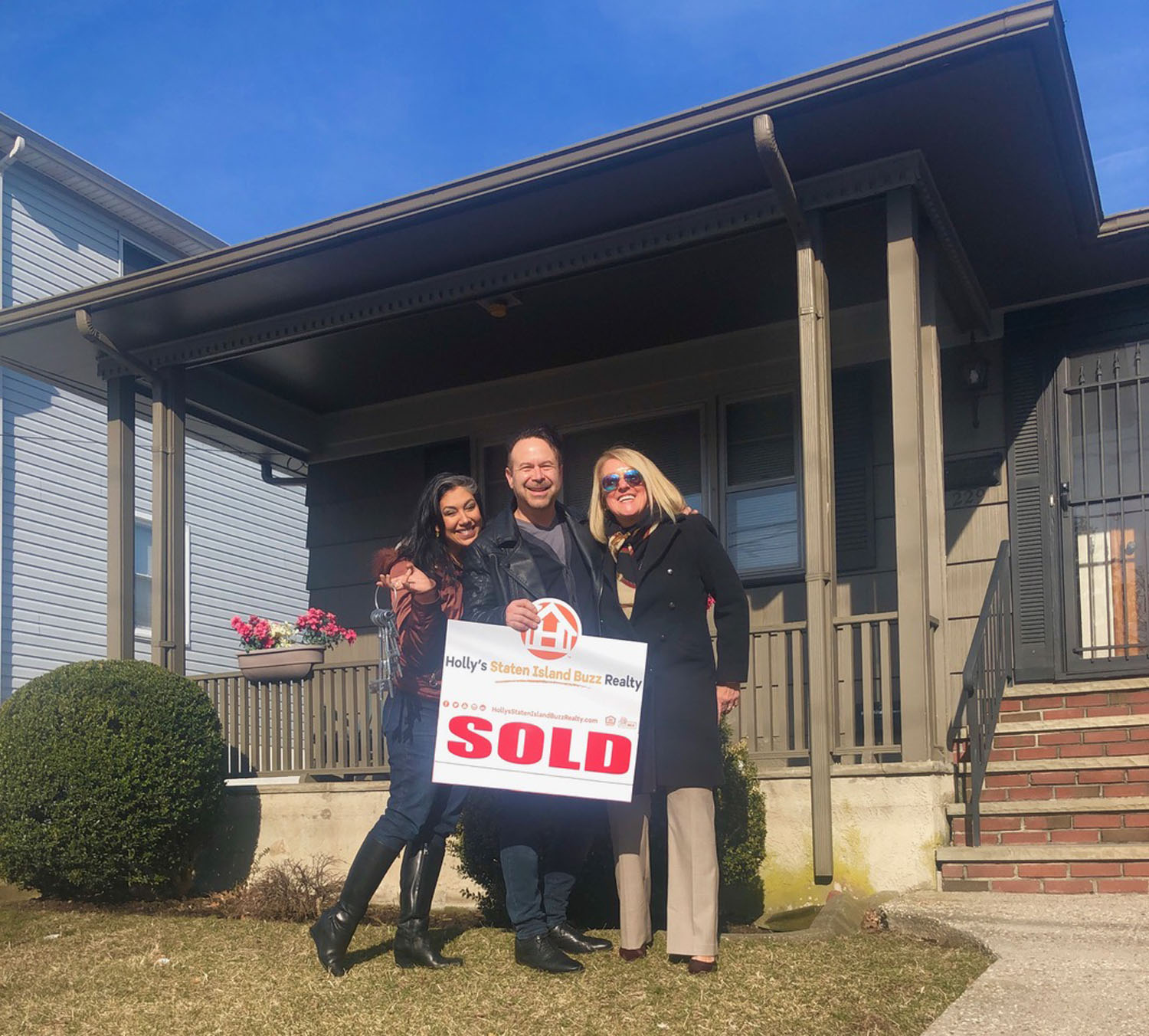 Happy Clients celebrate after using Holly's Staten Island Buzz Realty To Buy Their Staten Island Home